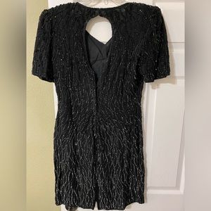 Gorgeous cocktail black dress worn only once.